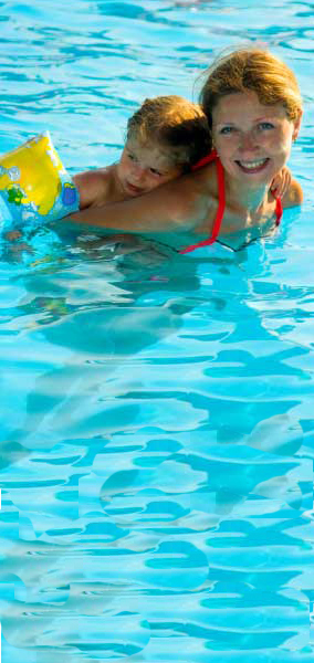 mom and son in custom pool by pool builder